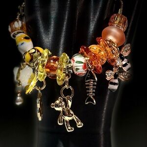 Elegant Gold and Orange Charm Bracelet